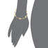 Illustration of a gray hand wearing the Good Luck Elephant Bracelet with multicolor birthstones, featuring a refined gold-filled design adorned with red, blue, and green gemstones. The bracelet's simple and elegant style enhances the wrist beautifully.